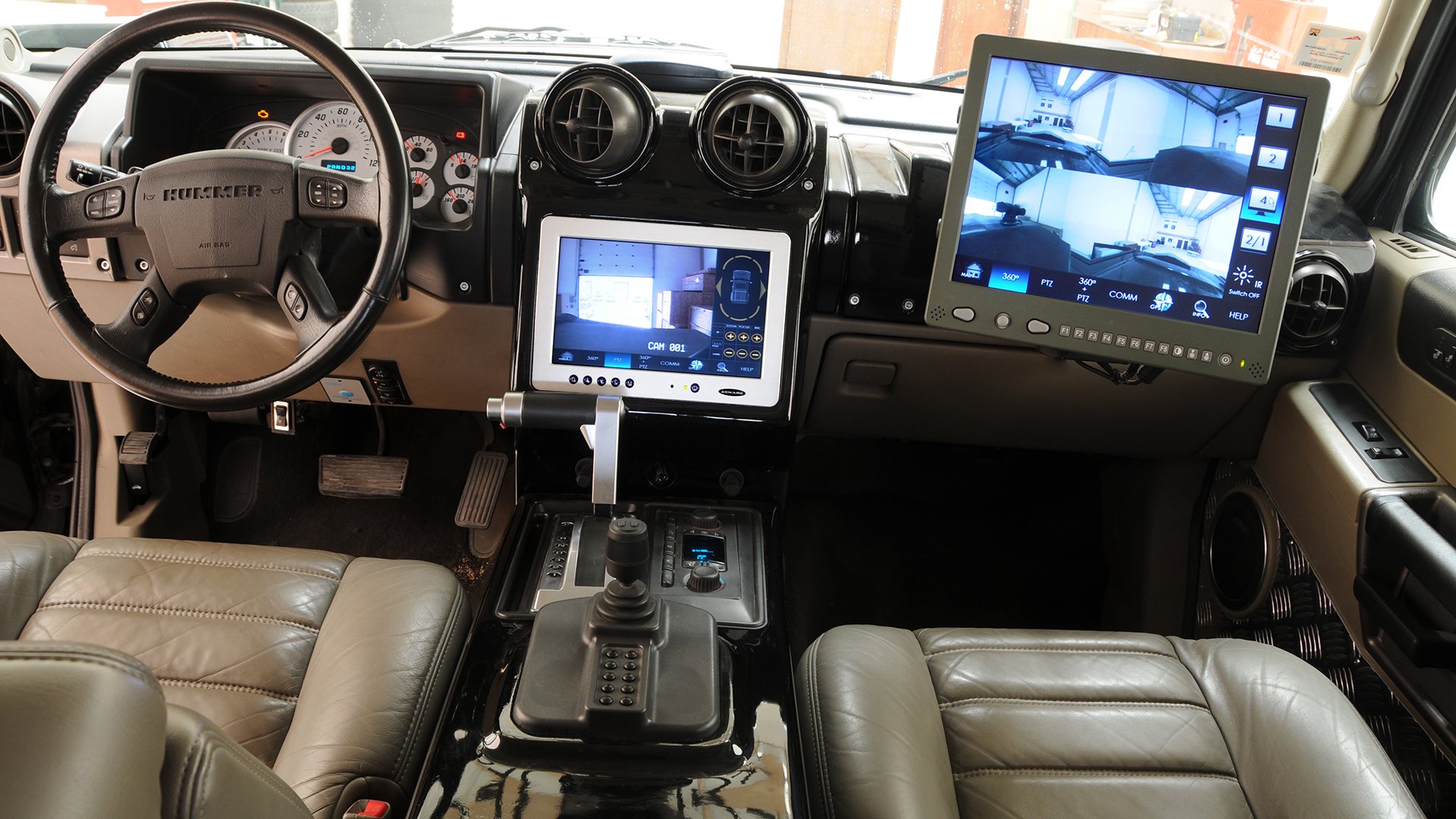 Driver and front passenger screens, with the joystick between the seats.